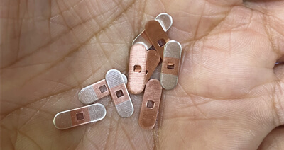 Frakt för stämplingar gjorda av silverinläggningsremsa